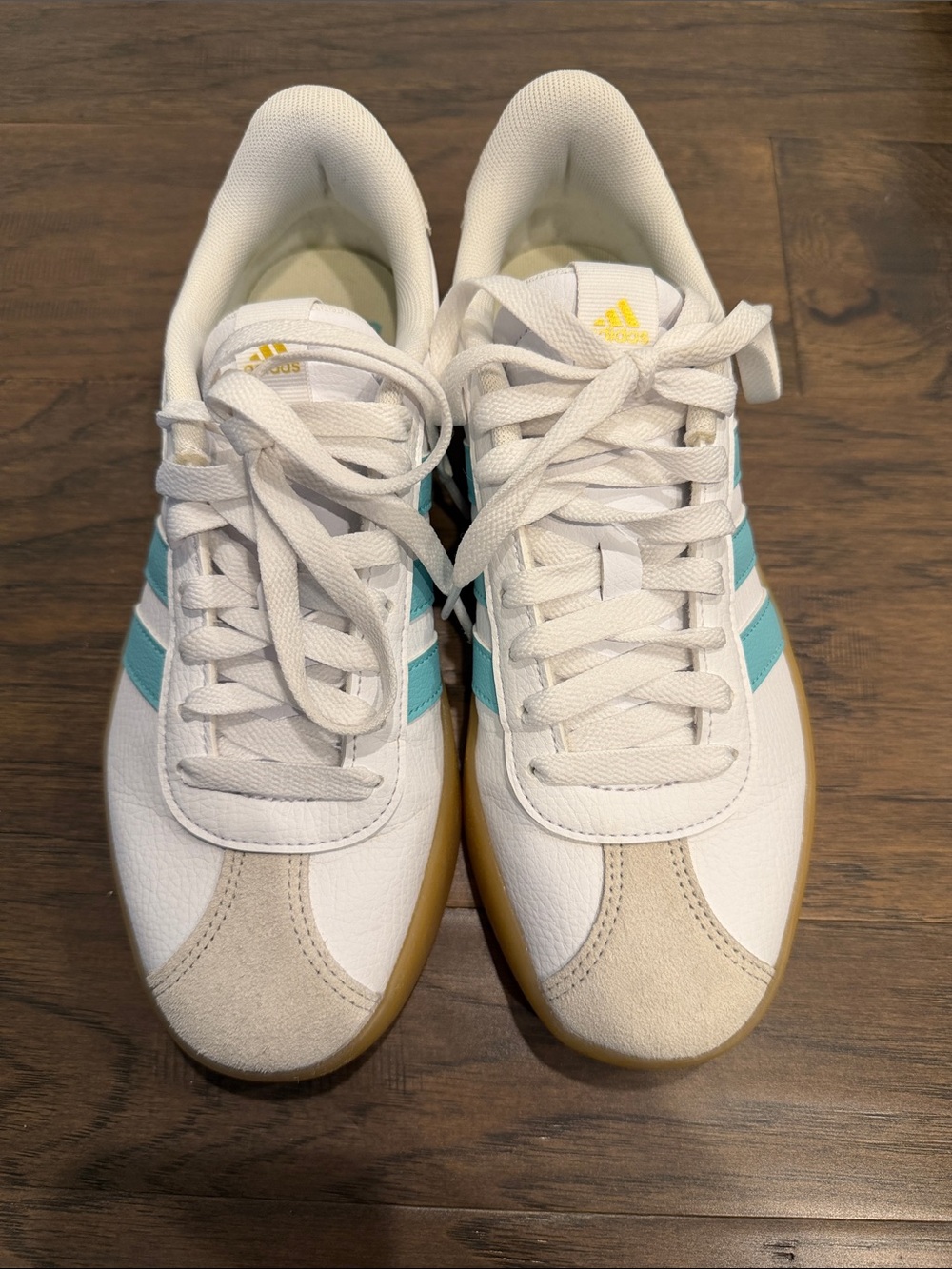 Adidas Women’s White Sneakers with Teal Stripes and Gum Sole
Worn once